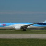 Tui Boeing 787-9 with blue and white fuselage on the runway against a clear-blue sky