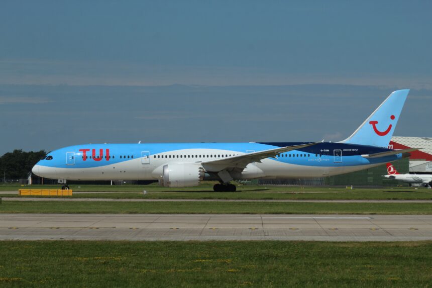 Tui Boeing 787-9 with blue and white fuselage on the runway against a clear-blue sky