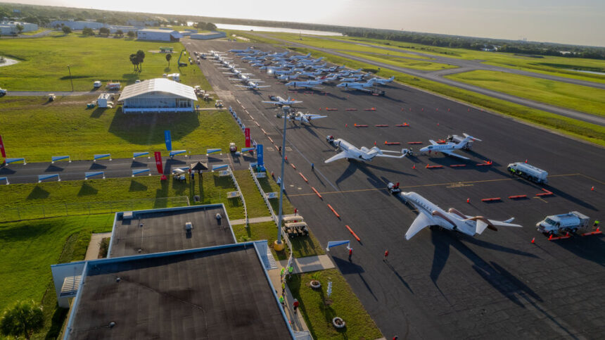 A line of Cessna Citation and Beechcraft aircraft parked on an airport apron as volunteer pilots prepare for the Special Olympics Airlift mission