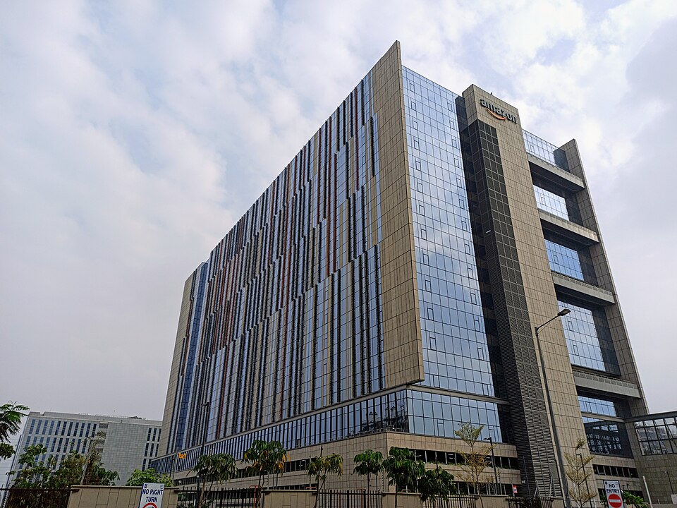 An exterior view of Amazon’s Hyderabad campus buildings and signage, used to represent Amazon’s broader technology ecosystem as it prepares Project Kuiper connectivity services for airlines.
