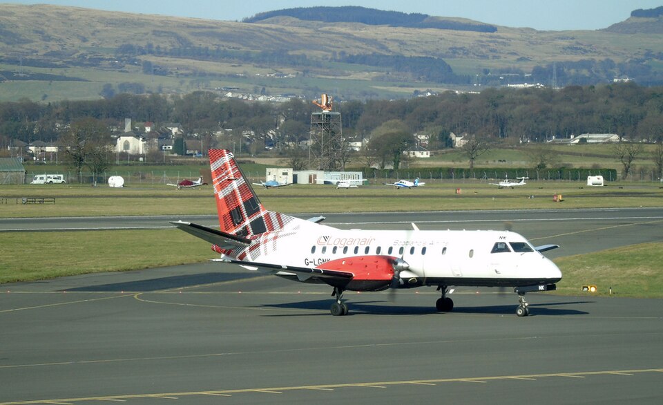The aircraft in the image is a Saab 340B twin-engine regional turboprop operated by Loganair. 