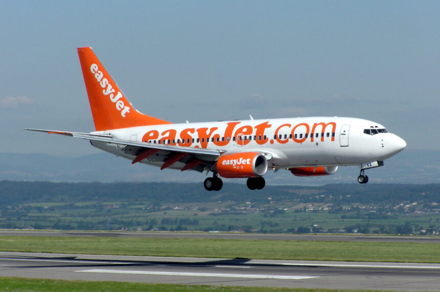 EasyJet Boeing 737-700 displaying its landing gear as it prepares to land at Bristol International Airport.