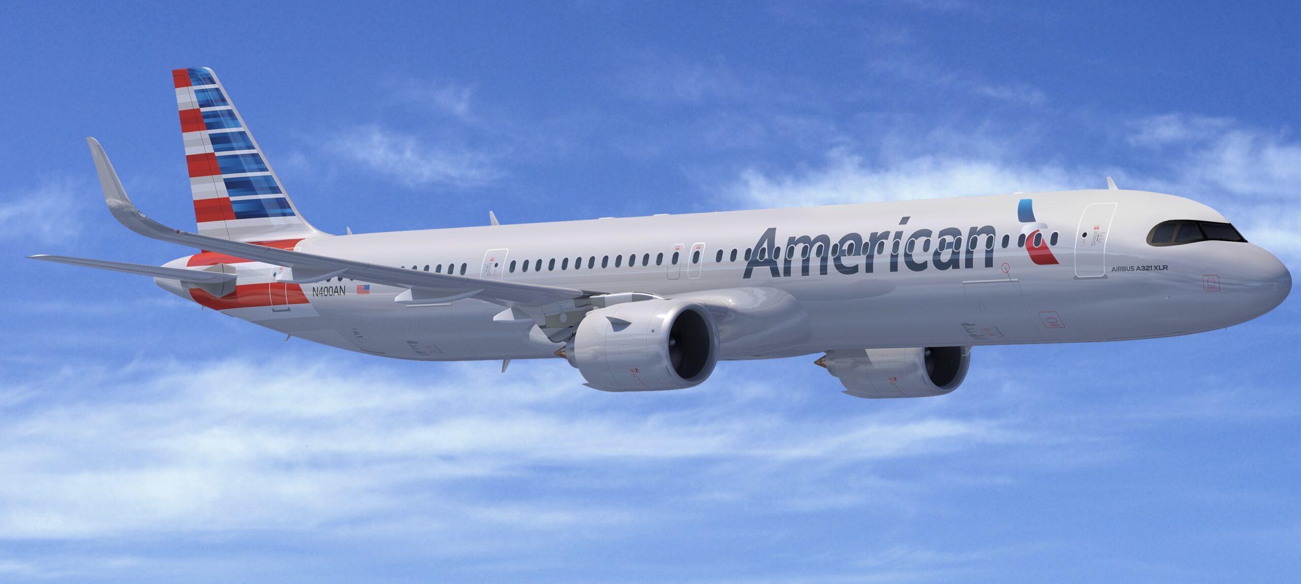 An American Airlines jet in front of a cloudy sky.