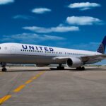 A United Airlines jet on a runway.