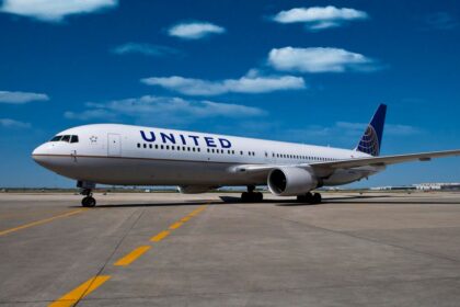 A United Airlines jet on a runway.