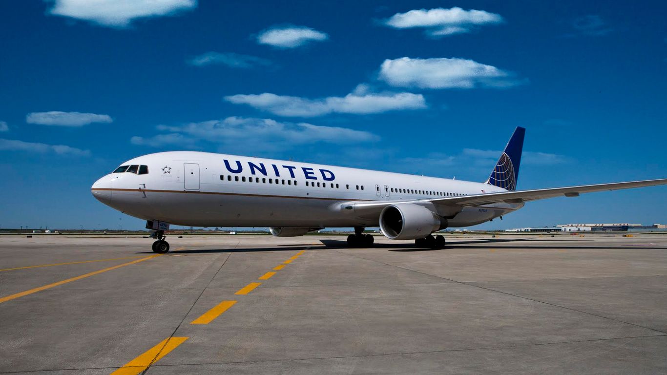 A United Airlines jet on a runway.