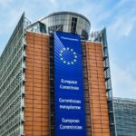 The EU Commission’s Berlaymont building in Brussels, with a European Commission banner hanging from the top.