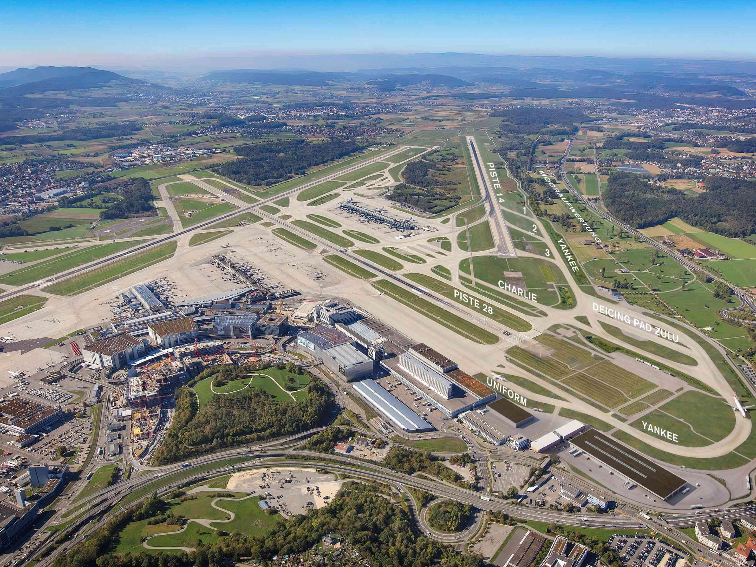 An aerial shot of the runways at Zurich Airport on a bright and clear day.