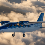 Tecnam P2012 traveller aircraft flying through the clouds