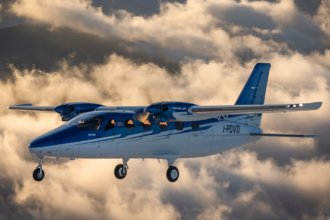 Tecnam P2012 traveller aircraft flying through the clouds