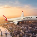 Qantas aircraft flying over London Thames and Tower Bridge amongst other main landmarks.