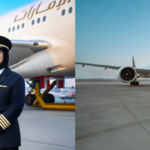 Image shows two female pilot captains in front of Emirates aircraft in daylight.