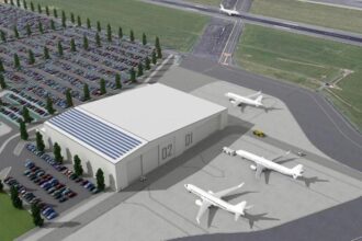 Image shows concept of Bristol Airport's proposed aircraft maintenance hangar with three aircraft parked nearby