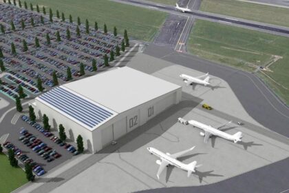 Image shows concept of Bristol Airport's proposed aircraft maintenance hangar with three aircraft parked nearby