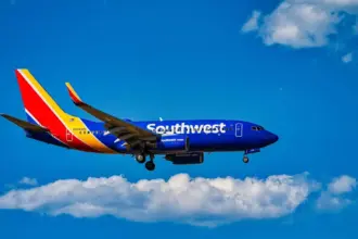 A Southwest Airlines Boeing 737 flying on blue sky
