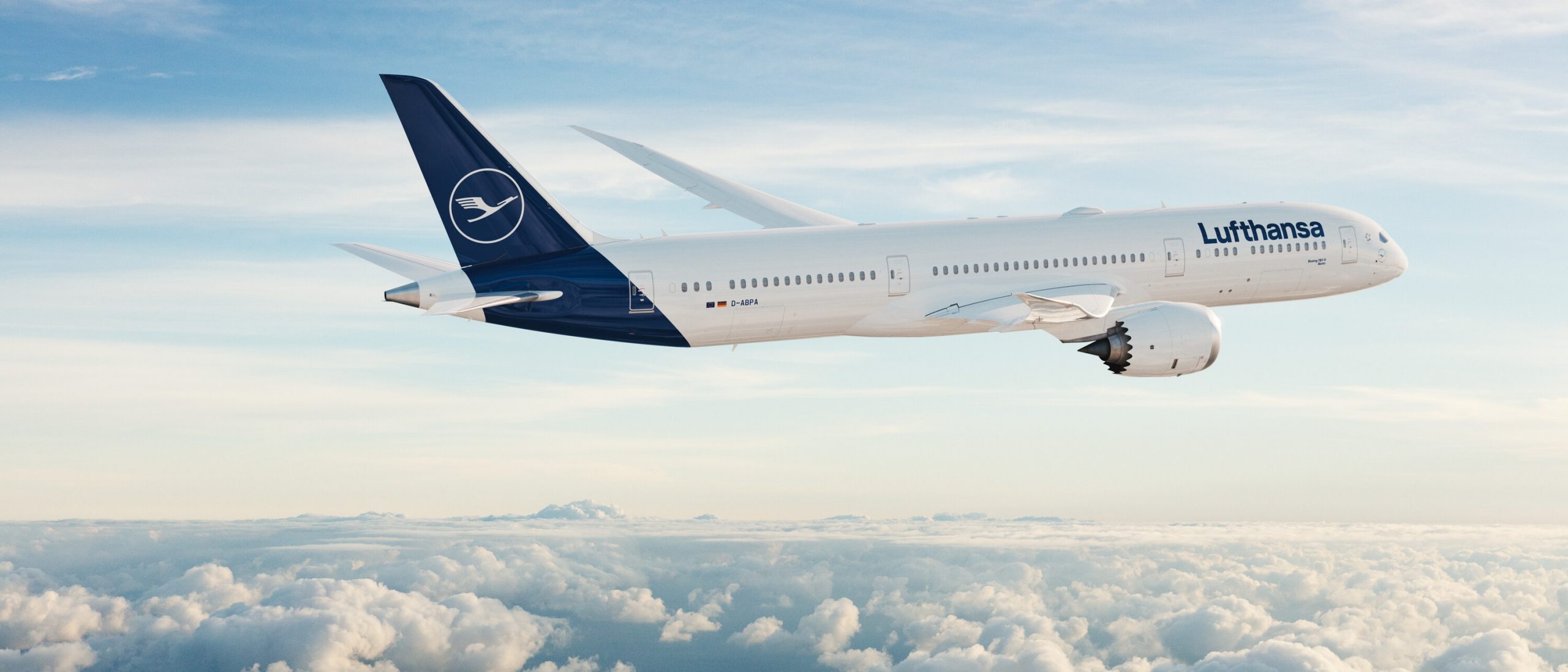 Lufthansa Boeing 787 side view flying above the clouds