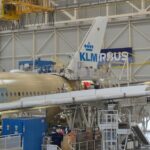KLM plane being structured in a warehouse.