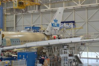 KLM plane being structured in a warehouse.