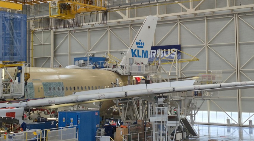 KLM plane being structured in a warehouse.
