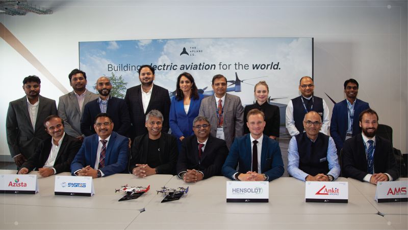 Representatives from the ePlane Company, Azista, SASMOS, HENSOLDT, Ankit Aerospace and AMS Heli Design pose together at a partnership signing event, with an ePlane branding screen reading 
