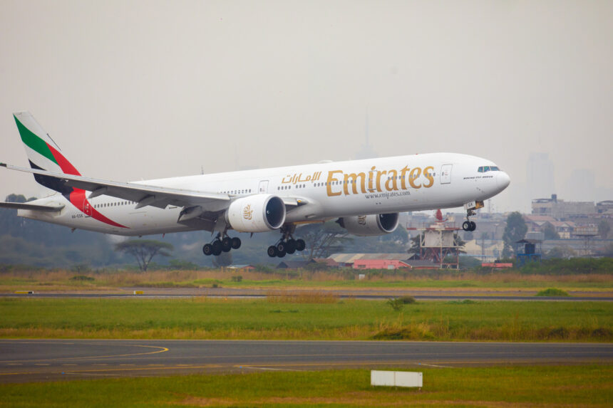 Emirates flight EK717 touching down on the runway.