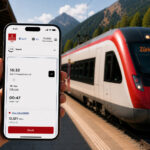 This image shows a hand holding a smartphone displaying the Emirates Skywards Rail booking page at a mountain train station, with a modern red-and-white train waiting on the platform in the background.