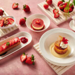 a table filled with the strawberry treats served in the different classes, including strawberries and cream and compote