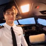 a selfie of Leandro Bertazzo in the cockpit of an aircraft wearing pilot uniform and smiling