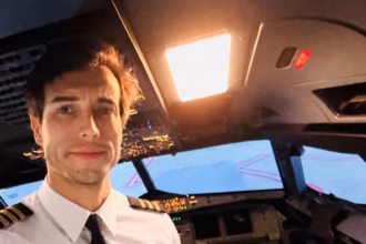 a selfie of Leandro Bertazzo in the cockpit of an aircraft wearing pilot uniform and smiling
