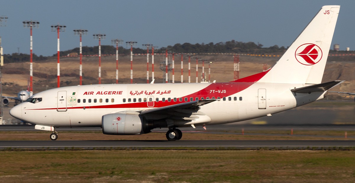 Air Algérie Boeing 737-600, registered 7T-VJS, taxiing on the runway.