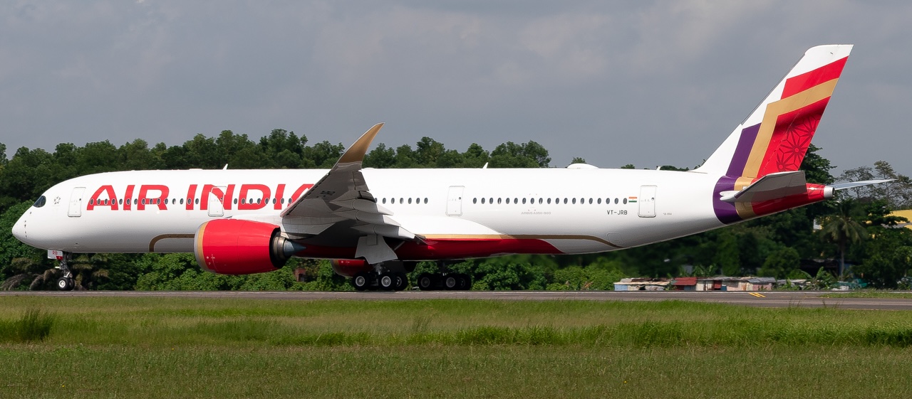 Side view of the full length of Air India's VT-JRB on the ground.