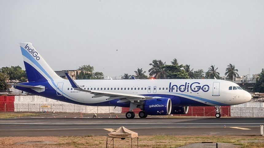 An IndiGo Airbus A320neo taxis along the runway at Mumbai Airport in the airline's distinctive blue-and-white livery. The fuel-efficient narrowbody aircraft, powered by next-generation engines, is preparing for departure on one of the carrier's domestic or international routes
