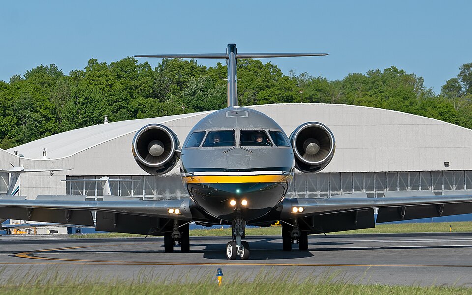 A front-facing view of a Contour Airlines regional jet taxiing at an airport, highlighting the carrier's modern fleet as it expands its Caribbean operations with the launch of a new fifth freedom route between Dominica and Trinidad.