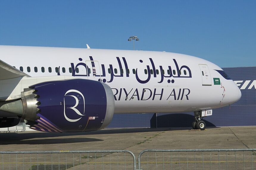 A Boeing 787 Dreamliner (registration N787EX) in Boeing's house livery on the ground. The aircraft features a sleek blue and white design with the "BOEING" logo and "787" model designation clearly visible on the fuselage and the dark blue tail fin.