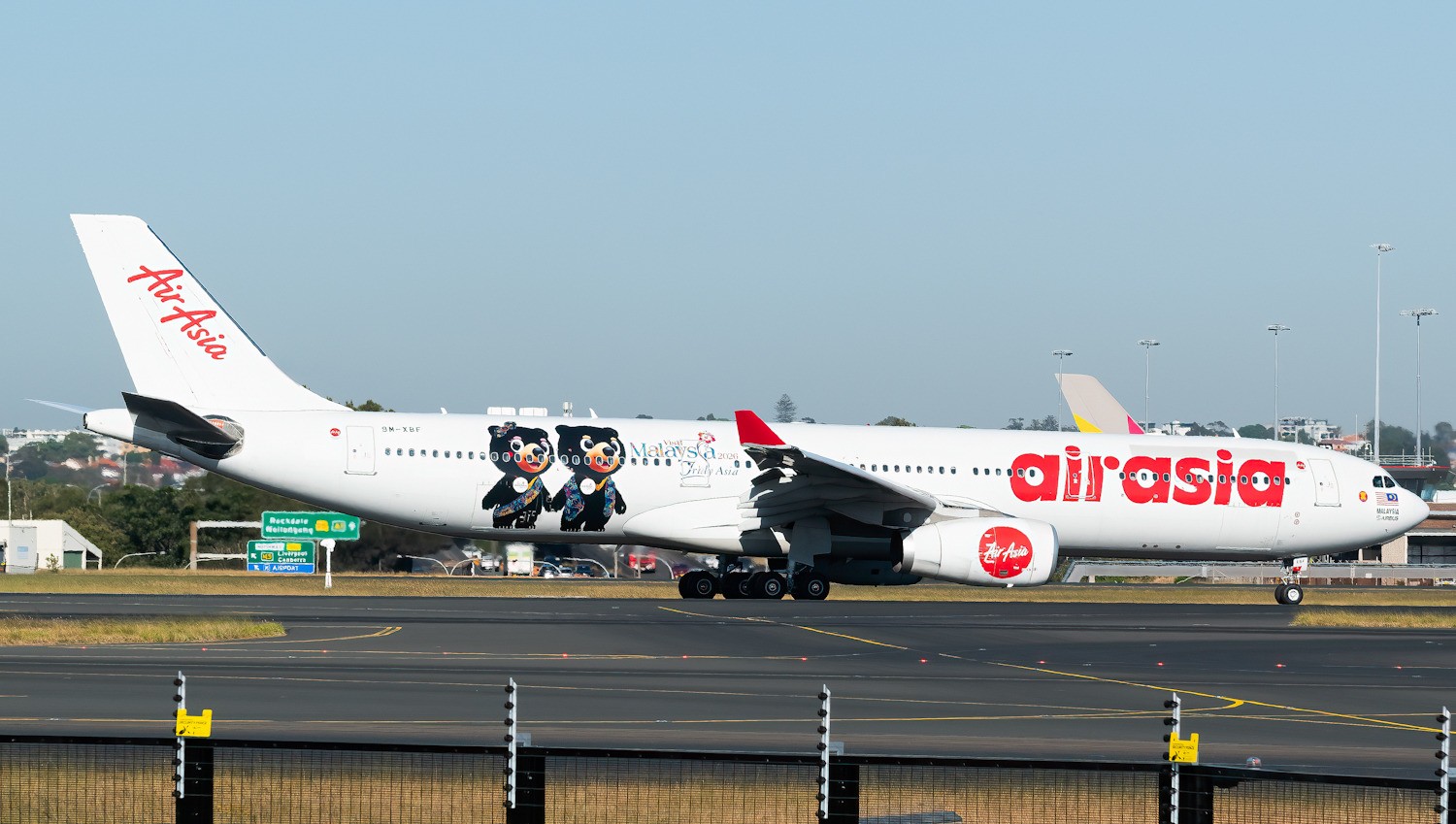 AirAsia X Airbus A330 in Visit Malaysia 2026 livery, taxiing at an airport.