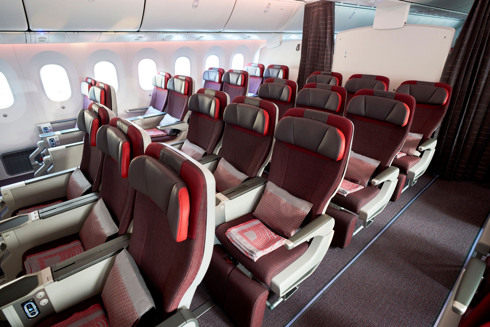 Photograph of the interiors of the B787-9. These interiors showcase the aircraft's innovative new design which is aimed at making passengers feel comfortable.