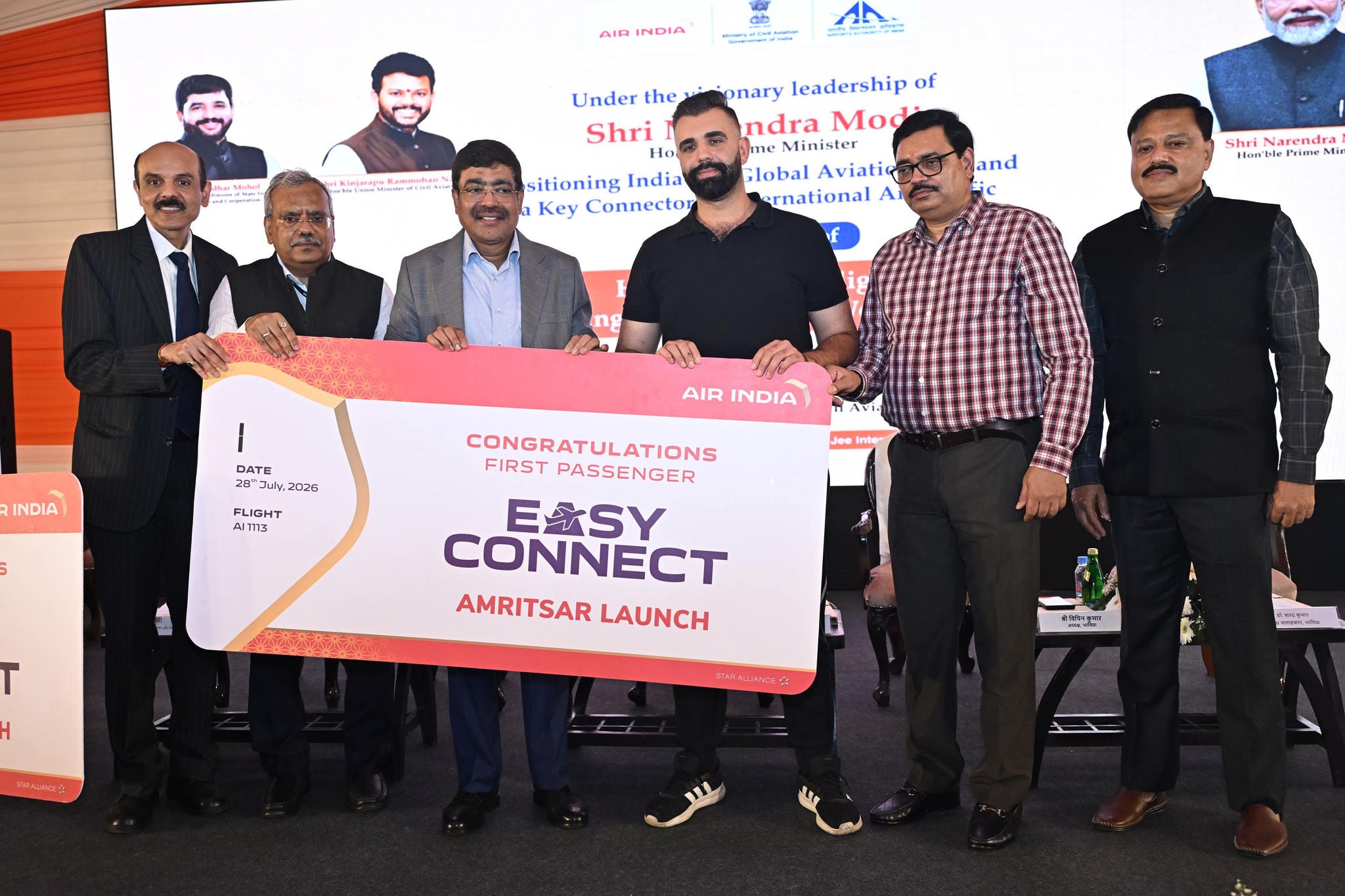 People standing together holding an 'Easy Connect' to highlight the launch of the service from Amritsar. 
