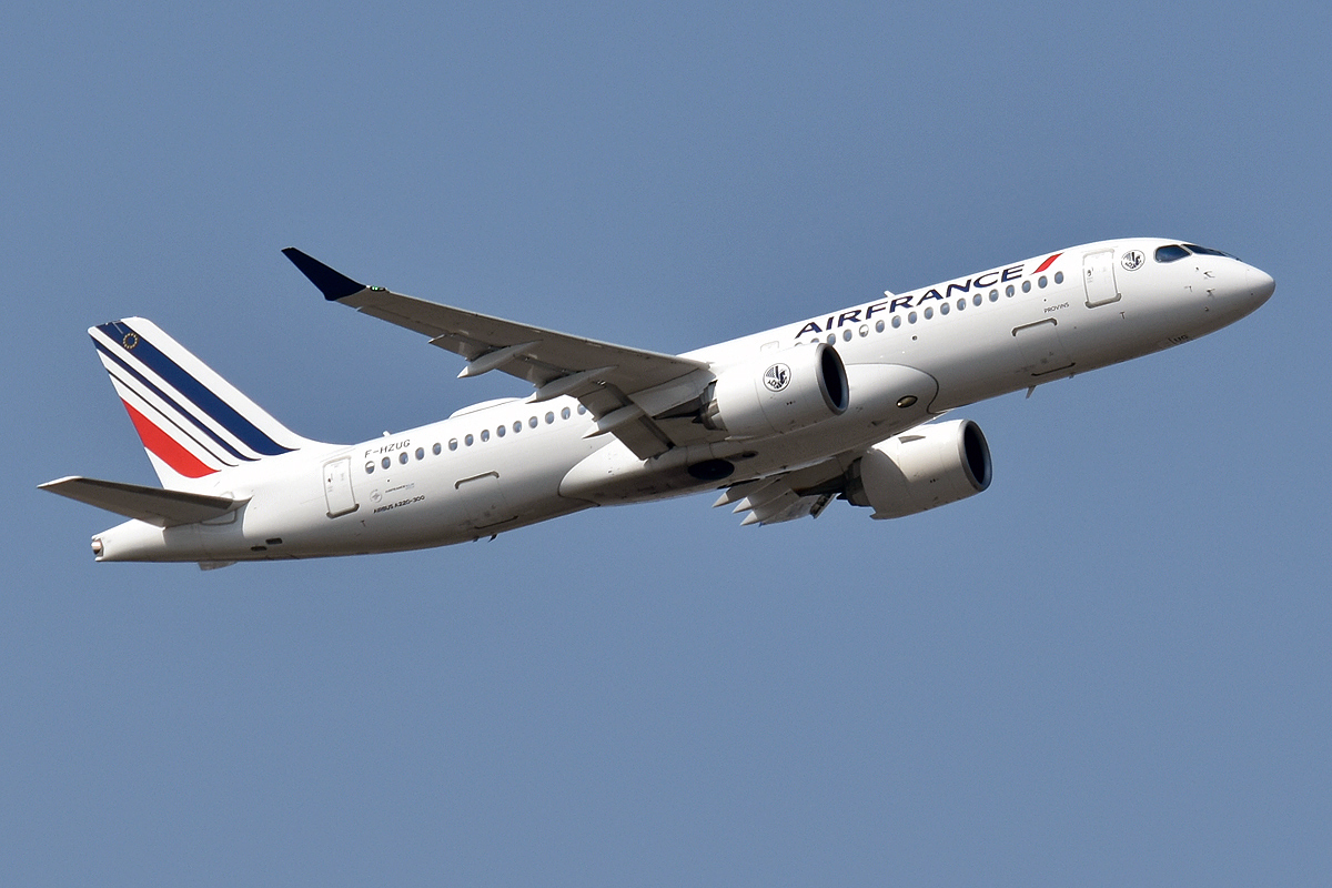 Full length side view of Air France's A220-300 aircraft taking off. Its landing gear are retracted.