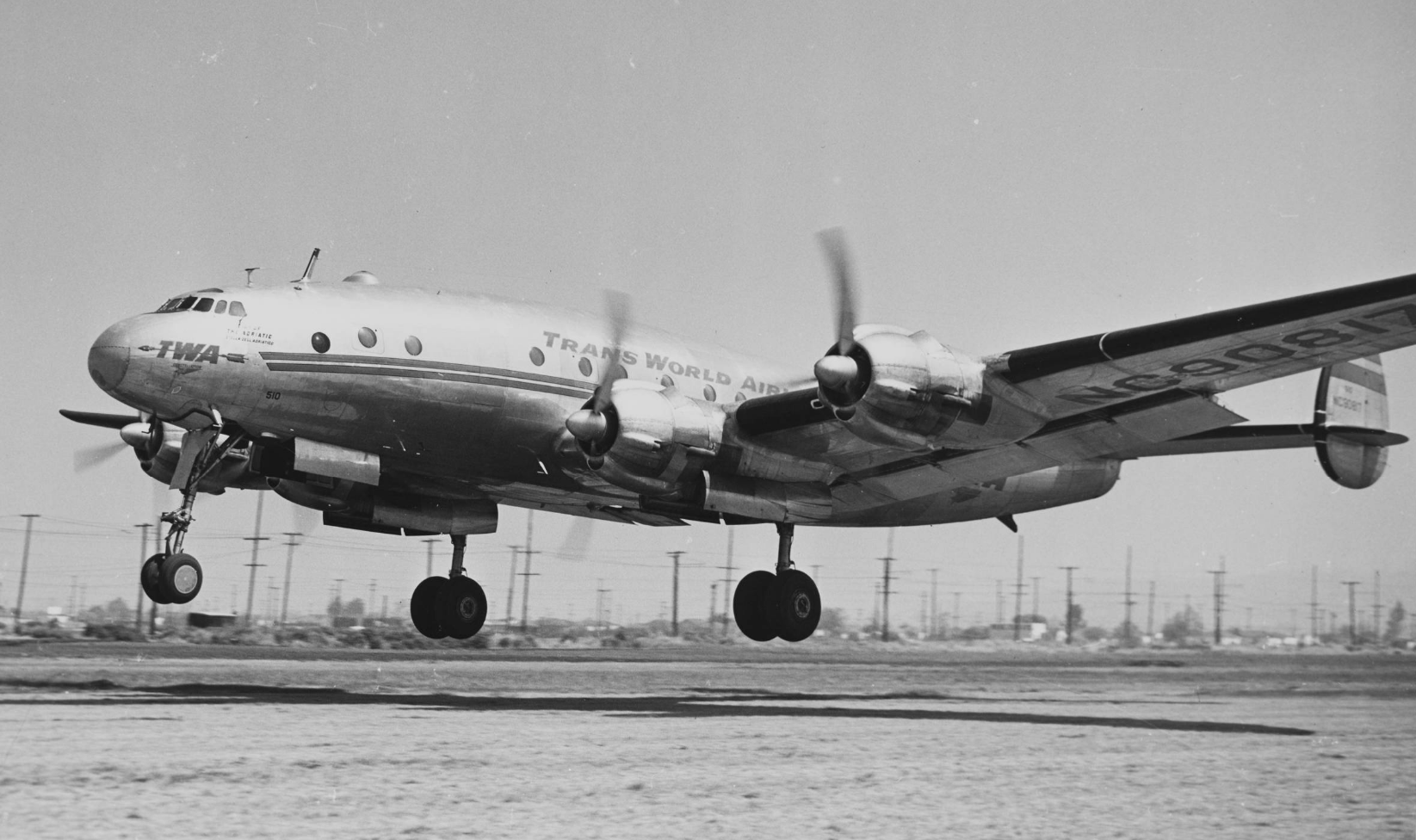 A Lockheed L-049 Constellation landplane in 1947, taking off. Black and white photograph.