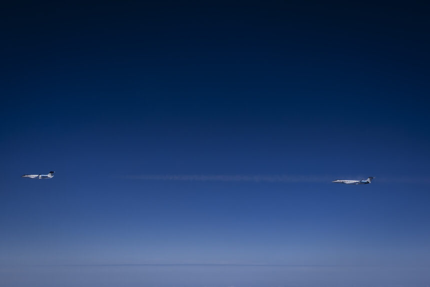 Image shows two Gulfstream 800 aircraft in a dark sky.