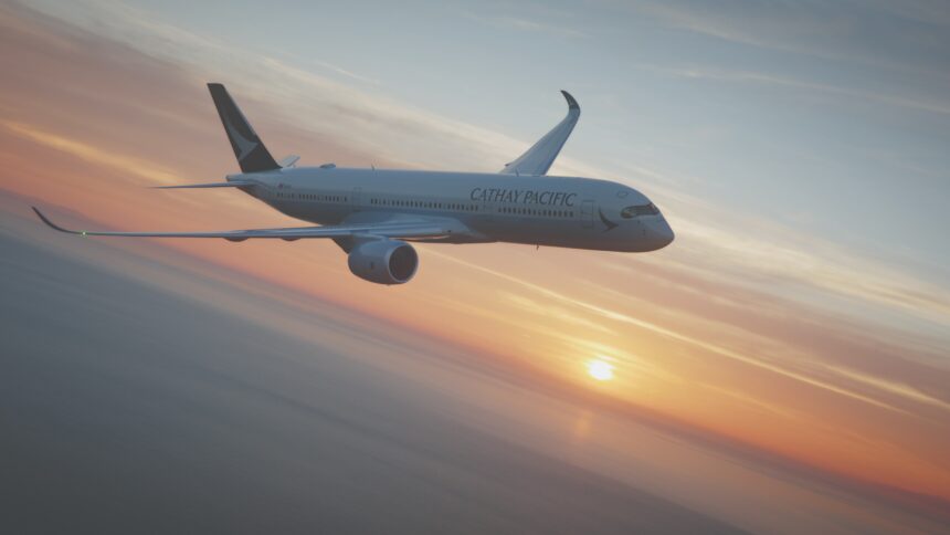 Image shows a Cathay Pacific A350-900 aircraft flying in a sunset