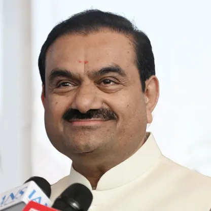 Guatam Adani, the second richest person in Asia, and primary owner of the Adani Group, smiles as he is interviewed by press.