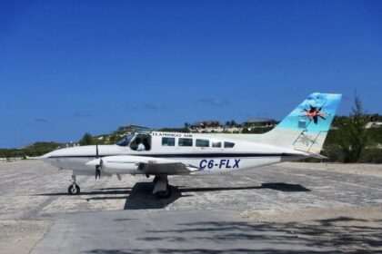 Cessna Aircraft C6-FLX on the tarmac; blue sky.