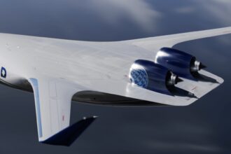 A blue and white Blended Wing Body Aircraft with United written in blue text on the side. The plane is flying through a cloudy sky over dark green ground.