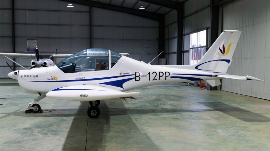 The blue and white B-12 PP plane, a Sunward Aurora SA60L, that would later be crashed by Liu, sat in a well-lit aircraft hanger.