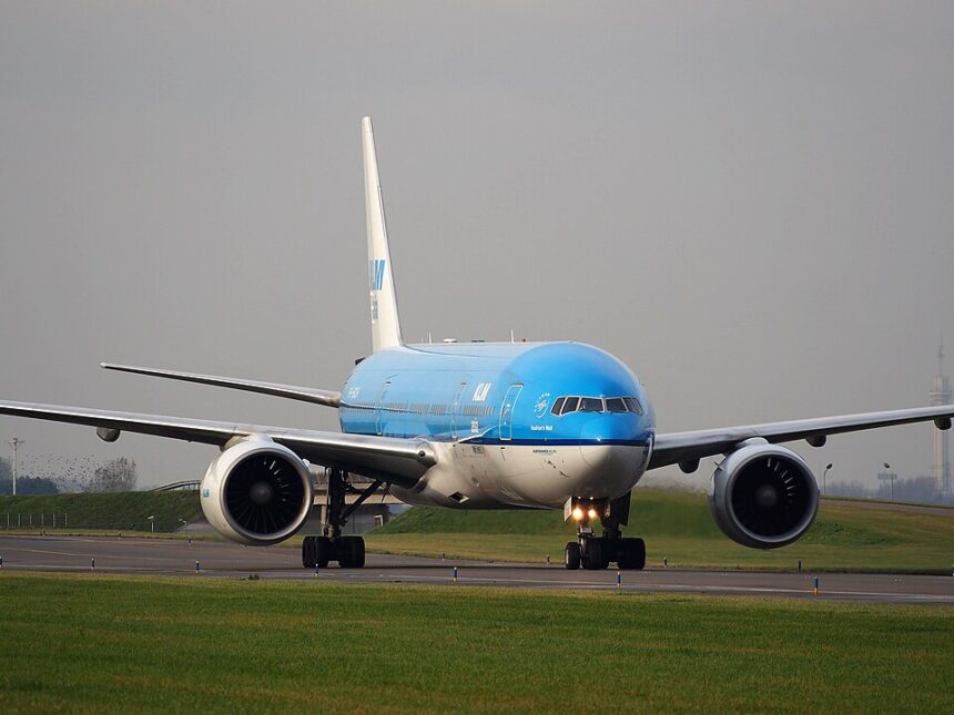 An image of a KLM aircraft taxing after landing on runway at Schiphol airport.