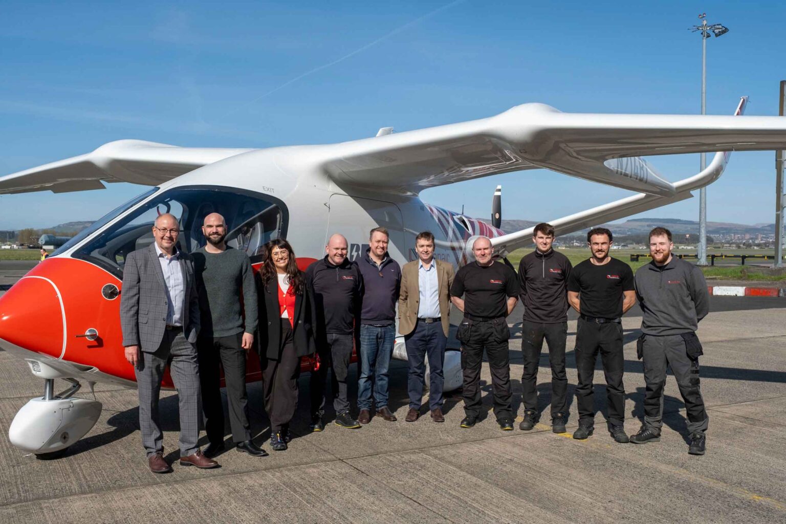 The Loganair, BETA Technologies and Royal Mail team pictured in front of the Alia CX300.