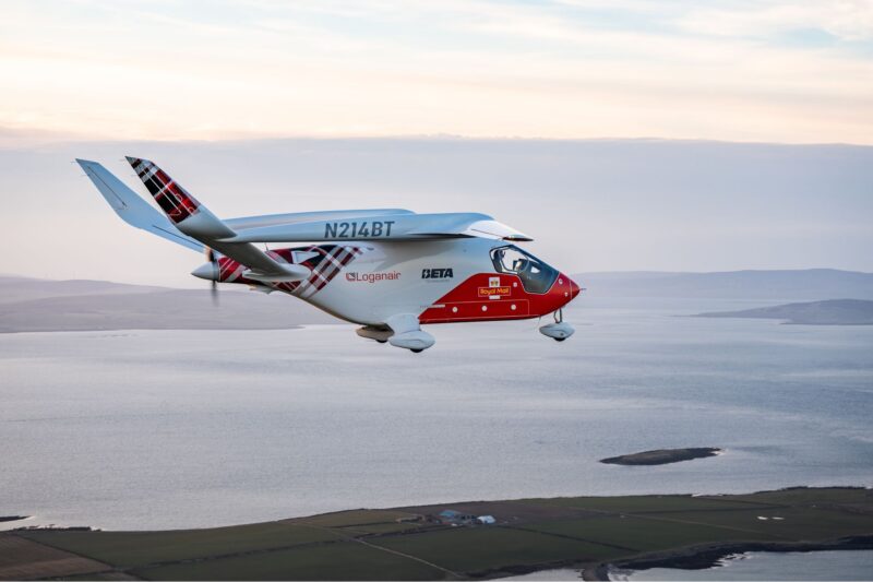 BETA’s ALIA electric aircraft shown midair, operating across Loganair’s network. The aircraft is decorated in the signature Loganair logo and tartan print.