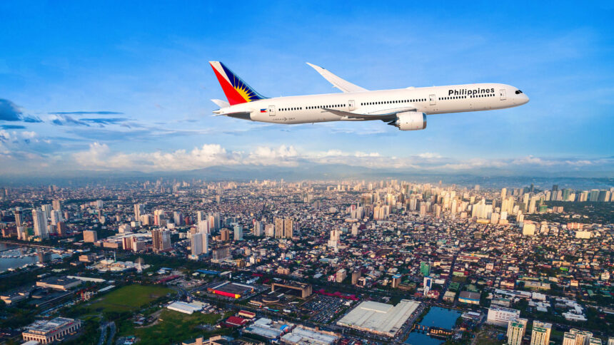Philippine Airlines 787-9 flying above Manila City with blue sky in the background
