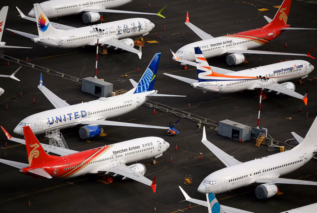An aerial view of several Boeing 737 MAX airplanes parked at King County International Airport.